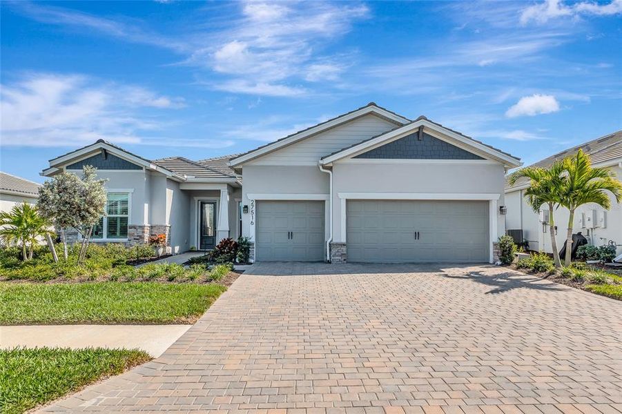 Front exterior of a new home in , Englewood, FL, highlighting curb appeal (Image 1). Front exterior of a new home in , Englewood, FL, highlighting curb appeal (Image 1).