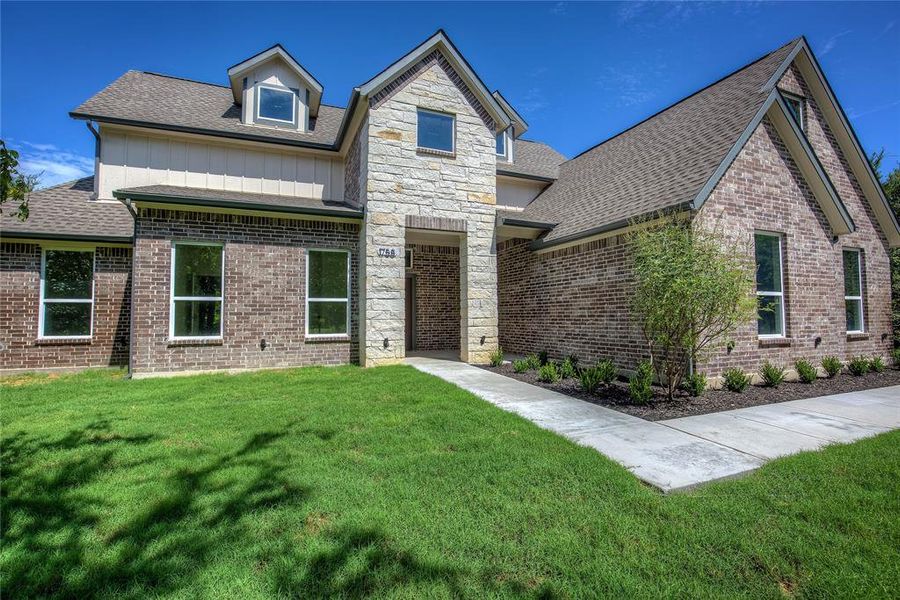Front exterior of a new home in , Terrell, TX, highlighting curb appeal (Image 1). Front exterior of a new home in , Terrell, TX, highlighting curb appeal (Image 1).