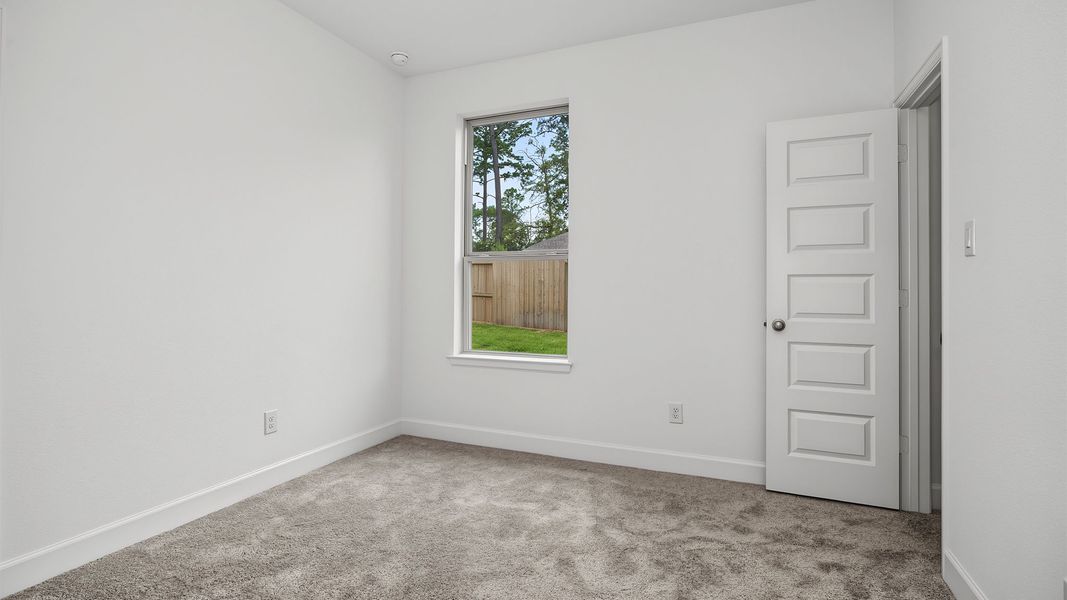 Spacious, unfurnished interior of a new home in The Woodlands Hills, Willis (Image 10).