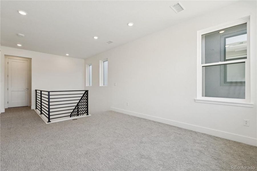 Spacious, unfurnished interior of a new home in Storytellers at Lyric, Lone Tree (Image 26).