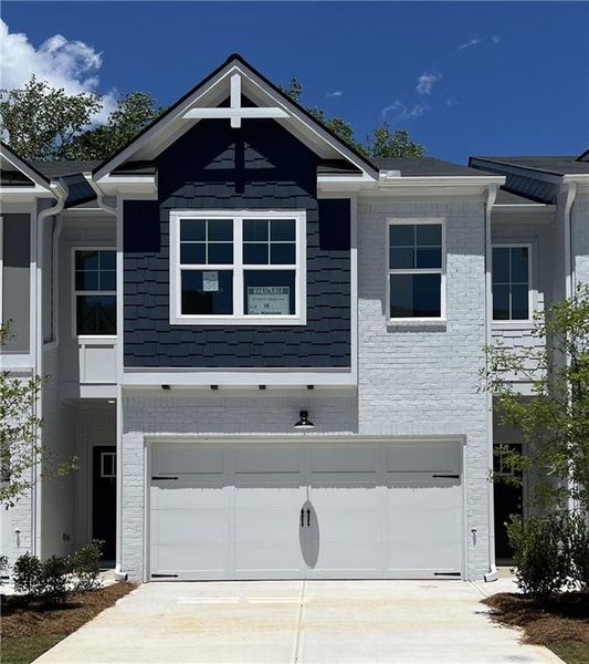Front exterior of a new home in Old Salem Crossing, Conyers, GA, highlighting curb appeal (Image 24). Front exterior of a new home in Old Salem Crossing, Conyers, GA, highlighting curb appeal (Image 24).