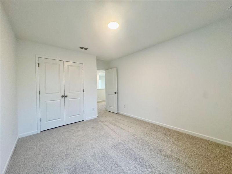 Spacious, unfurnished interior of a new home in Eastlyn Crossing, Flowery Branch (Image 12).