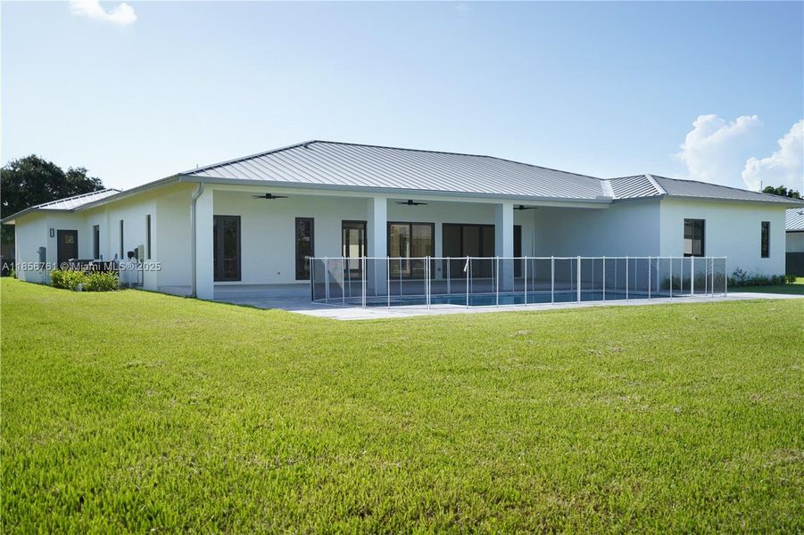 Front exterior of a new home in , Homestead, FL, highlighting curb appeal (Image 44).