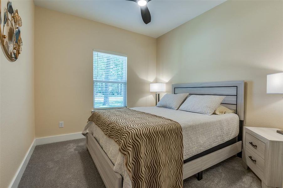 Guest bedroom with queen bed and nightstands. Guest bedroom with queen bed and nightstands.