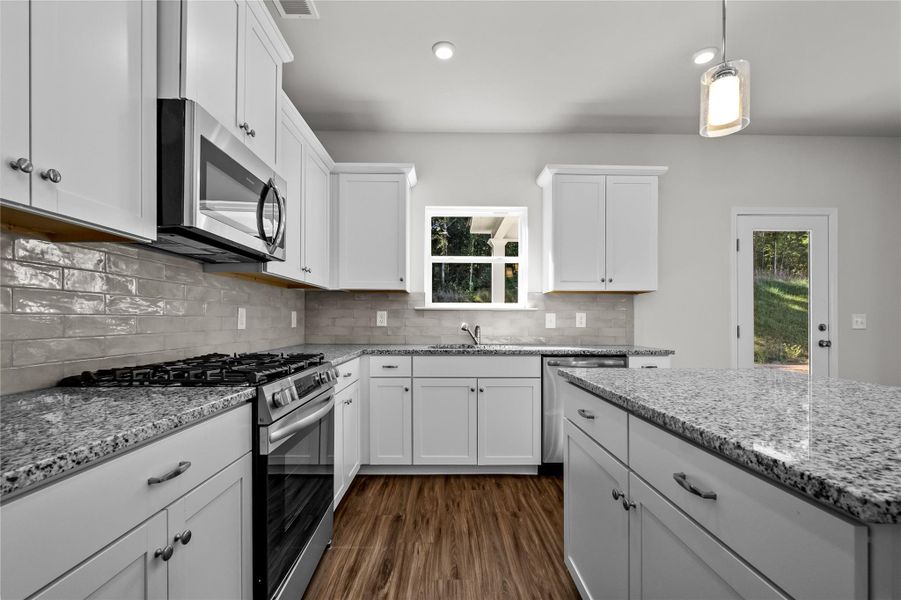 The Coleman- Kitchen. Home under construction, photo used for illustrative purposes only, colors and options will vary. The Coleman- Kitchen. Home under construction, photo used for illustrative purposes only, colors and options will vary.