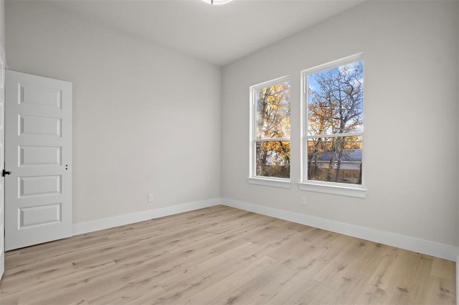 Spare room with light wood-type flooring