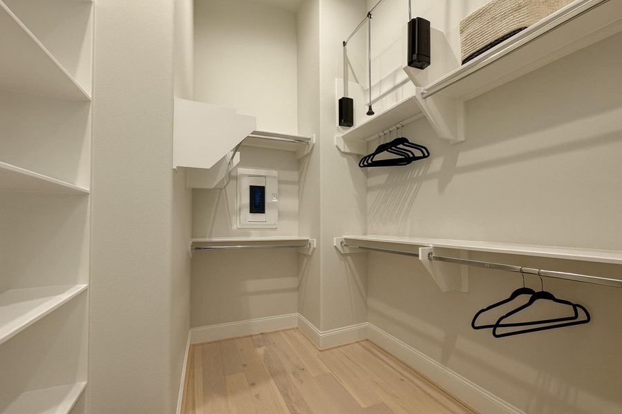 Ultra-spacious primary closet!   Hangers added virtually.