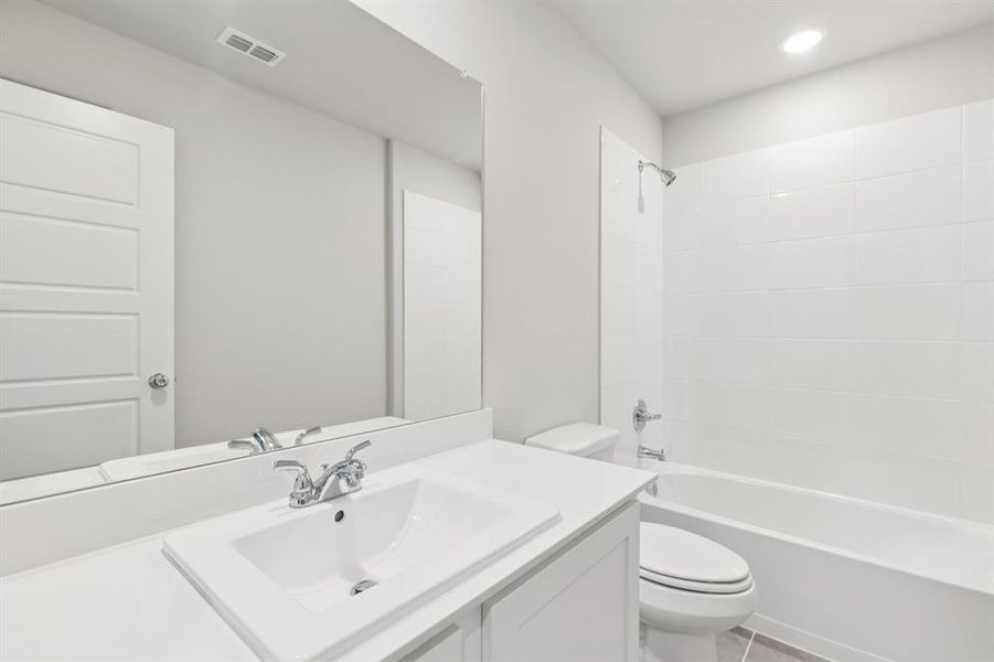 Bathroom in the Harrison home plan by Trophy Signature Homes – REPRESENTATIVE PHOTO Bathroom in the Harrison home plan by Trophy Signature Homes – REPRESENTATIVE PHOTO