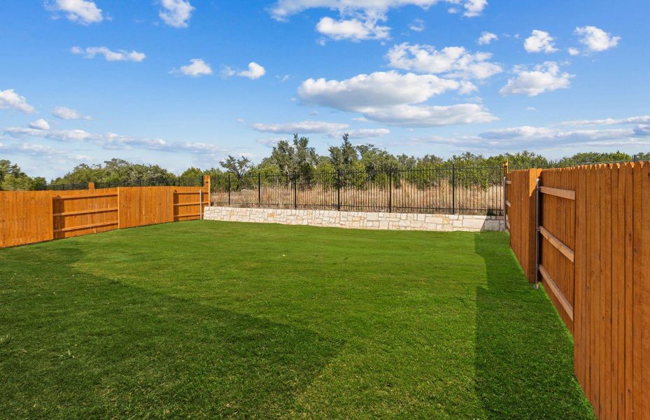 Exterior details and patio area of a home in West Cypress Hills, Spicewood (Image 2).