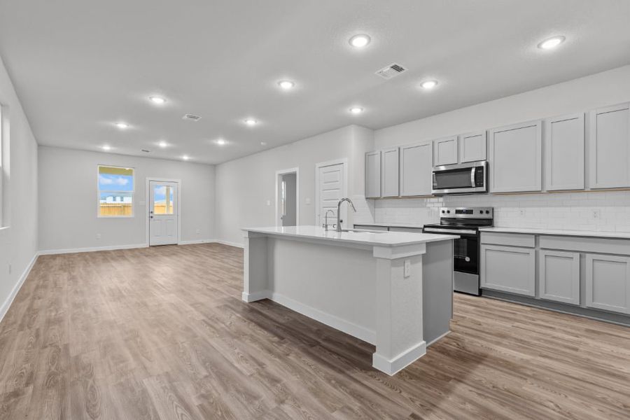 A kitchen with white cabinets. A kitchen with white cabinets.