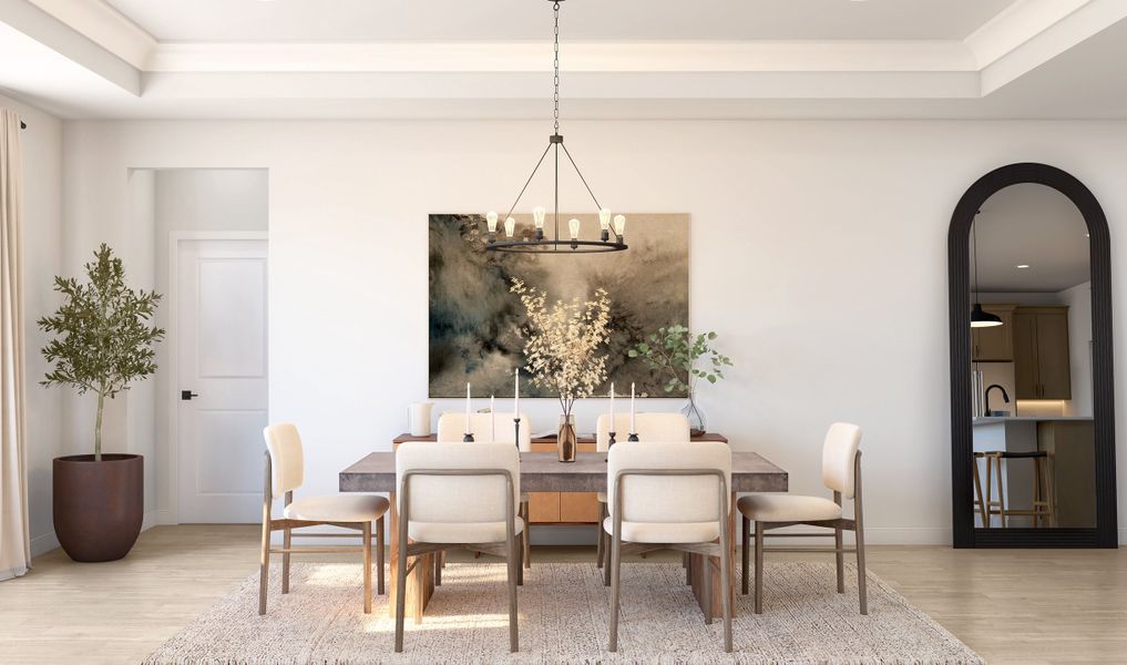 Dining area with tray ceiling and crown moulding