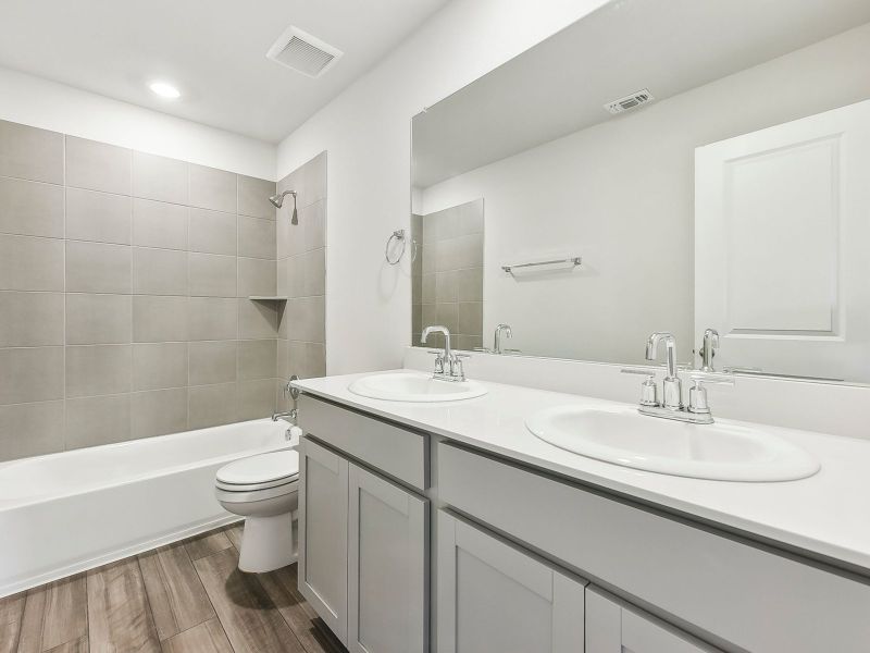 The upstairs full bathroom helps make getting ready easier for everyone.