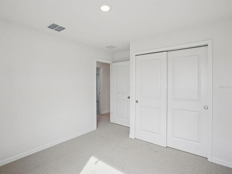 Spacious, unfurnished interior of a new home in The Grove at Stuart Crossing - Classic Series, Bartow (Image 37).