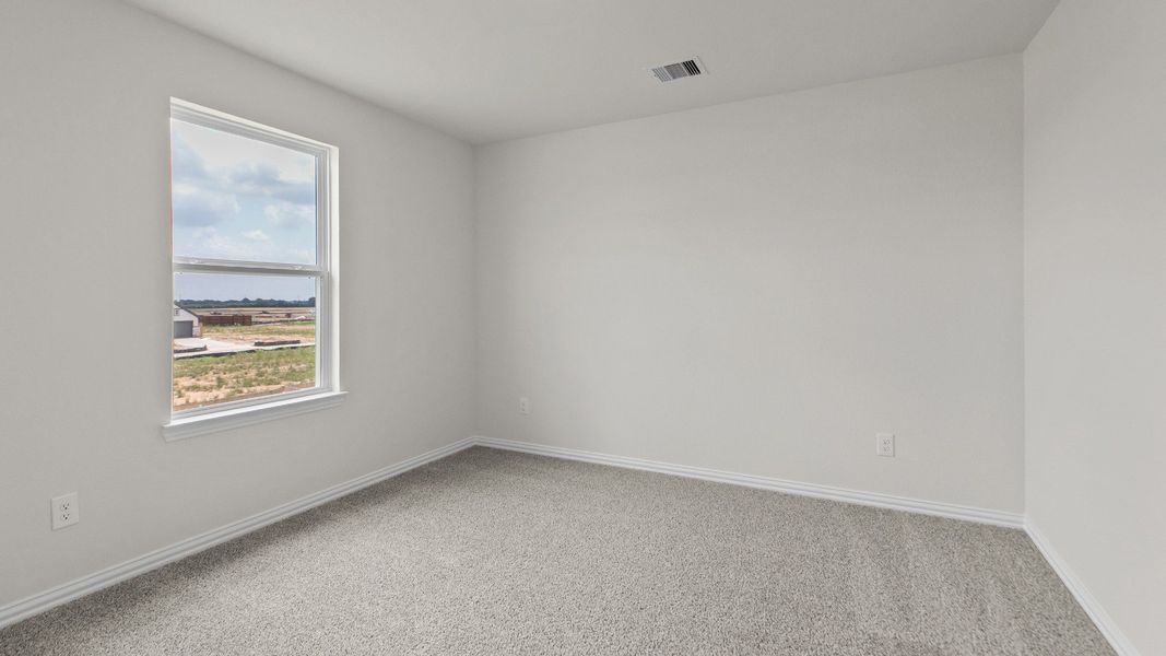 Representative furnished interior of a home built from the Southfork by Brightland Homes in Sunterra, Katy (Image 15).