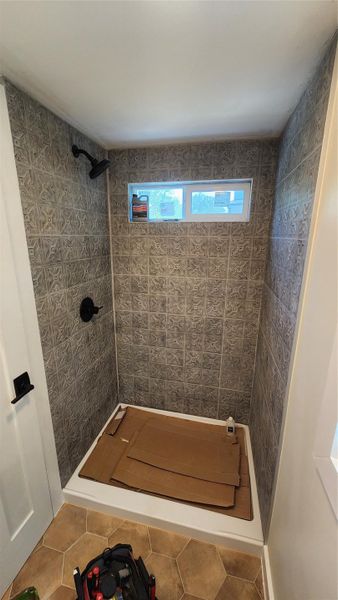 Shower with vented window. There is also a bathroom vent. Still cleaning up the tile. Shower with vented window. There is also a bathroom vent. Still cleaning up the tile.