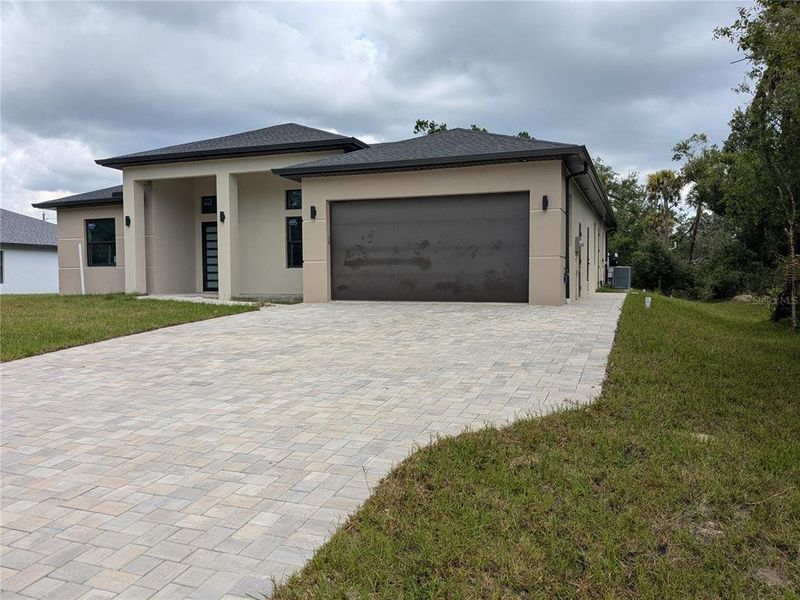 Front exterior of a new home in , Port Charlotte, FL, highlighting curb appeal (Image 27).