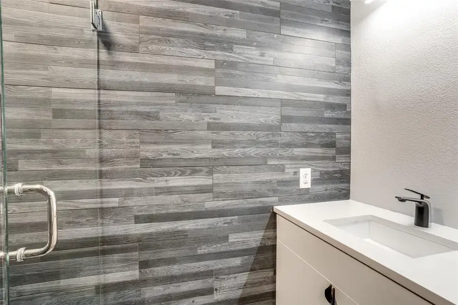 Photos are of unit #204. Unit #101 will feature white cabinets and grey wood floors. Photos are of unit #204. Unit #101 will feature white cabinets and grey wood floors.
