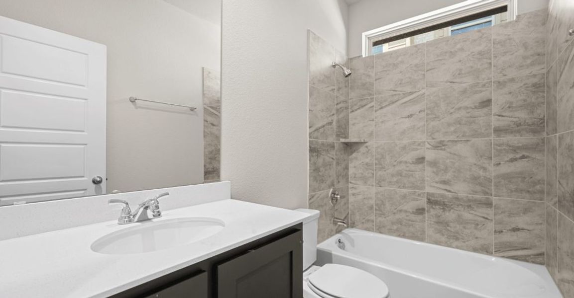 Representative exterior photo of a completed home built from the Donnington by Impression Homes in Still Water Lake, Godley, TX (Image 23).