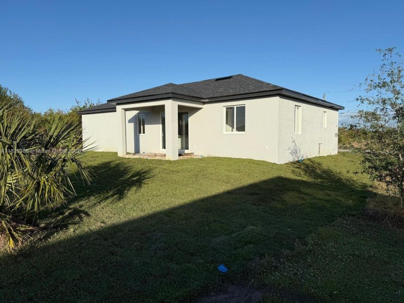 Front exterior of a new home in , Port Charlotte, FL, highlighting curb appeal (Image 19).