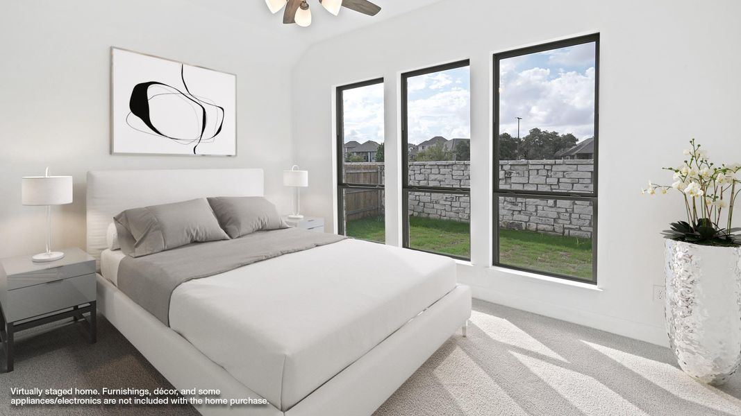 Bedroom featuring carpet, a ceiling fan, and vaulted ceiling