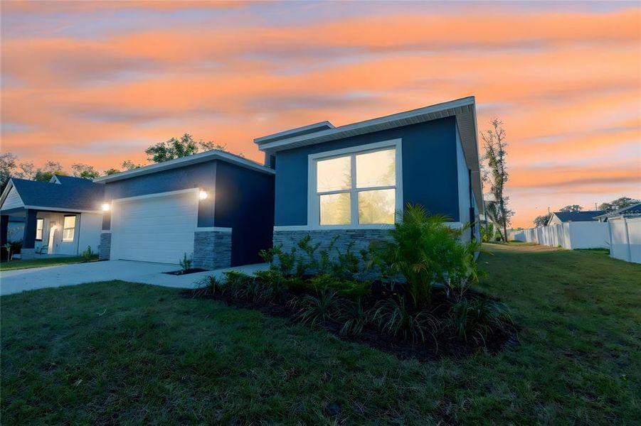 Front exterior of a new home in , Tavares, FL, highlighting curb appeal (Image 27).