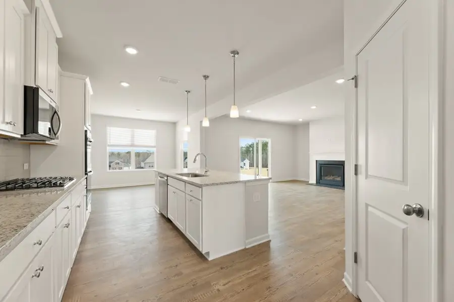 A kitchen with white cabinets. A kitchen with white cabinets.