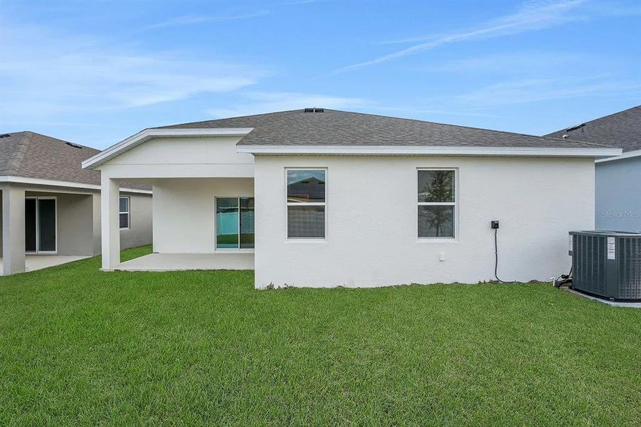 Exterior details and patio area of a home in Cypress Park Estates, Haines City (Image 24).
