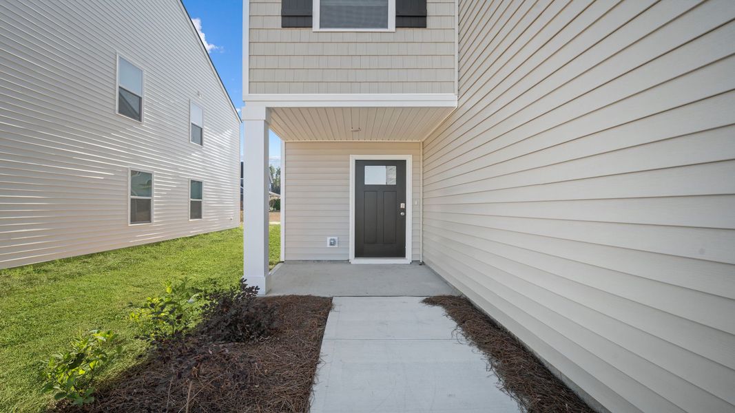 Exterior details and patio area of a home in The Groves at Bees Creek, Ridgeland (Image 2). Exterior details and patio area of a home in The Groves at Bees Creek, Ridgeland (Image 2).