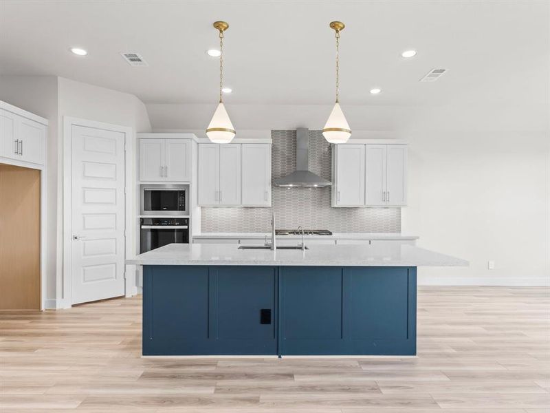 2 Tone Island Kitchen with Space for Stools and Pendant Lighting.