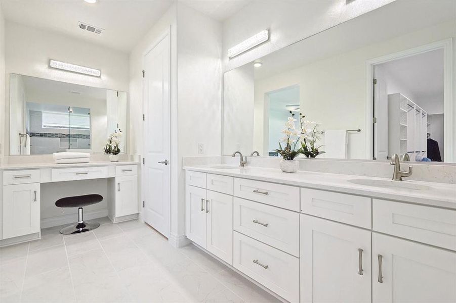 Bathroom with tile floors, dual sinks, and large vanity