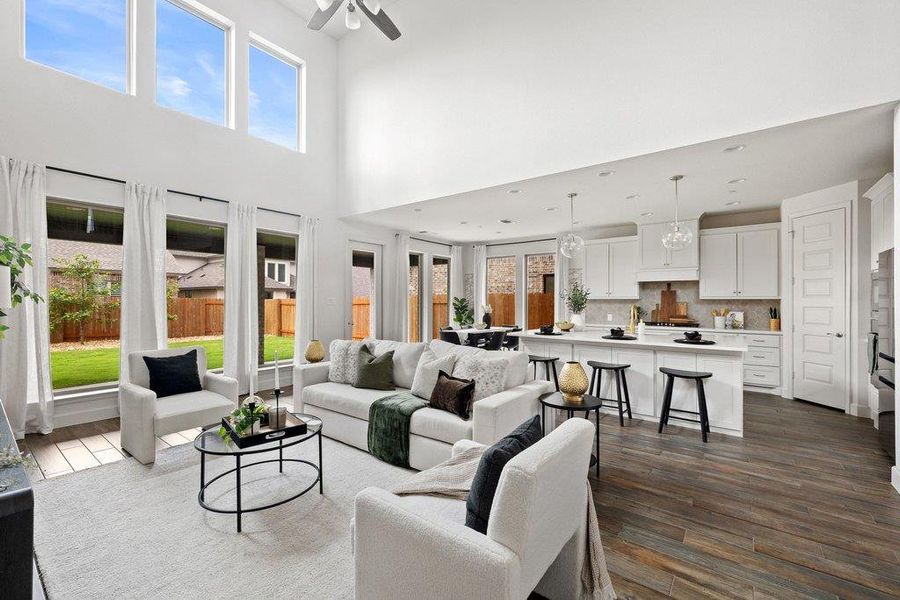A spacious, airy interior features soaring ceilings and an open-concept design for seamless living.