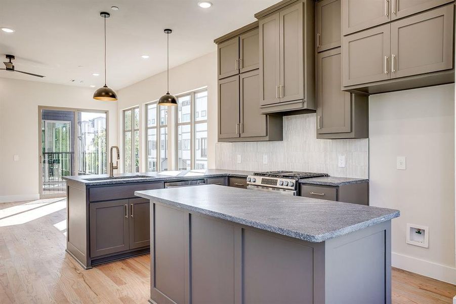 Custom cabinetry offers ample storage and seamless integration with the open-concept layout. Custom cabinetry offers ample storage and seamless integration with the open-concept layout.