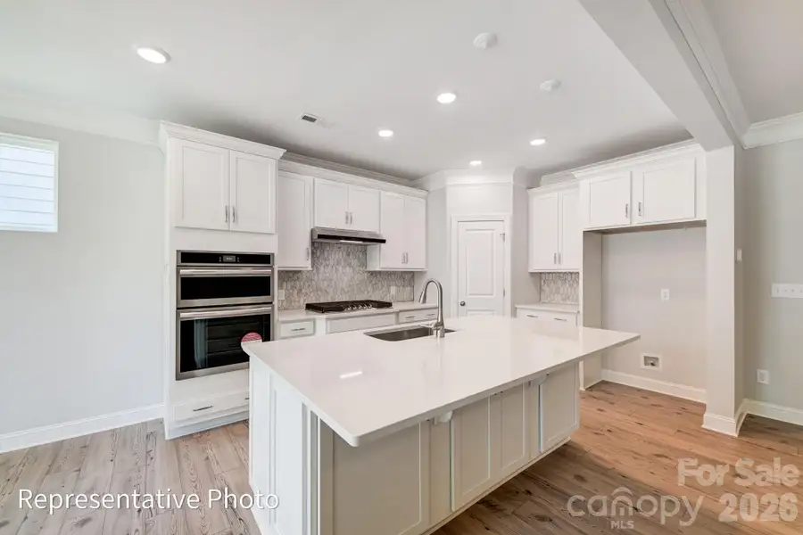 Furnished interior view inside a new home in Heritage - 55+ Community, Indian Trail (Image 7).
