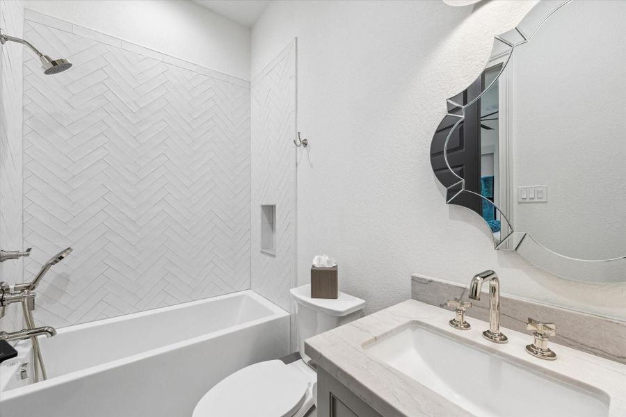 Finished with timeless materials and elegant fixtures, this beautifully designed bath complements the surrounding suite with understated luxury. Clean architectural lines and quality craftsmanship provide both beauty and everyday functionality.