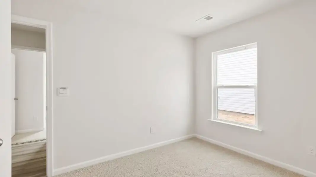 Spacious, unfurnished interior of a new home in Village Grove, Greenville (Image 18).