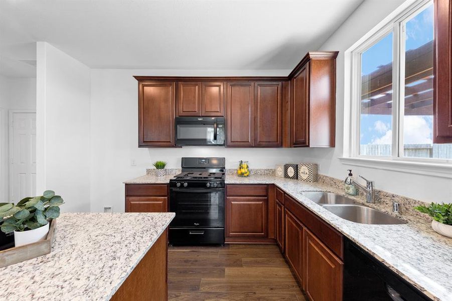 The kitchen features a large island, perfect for preparing home meals.