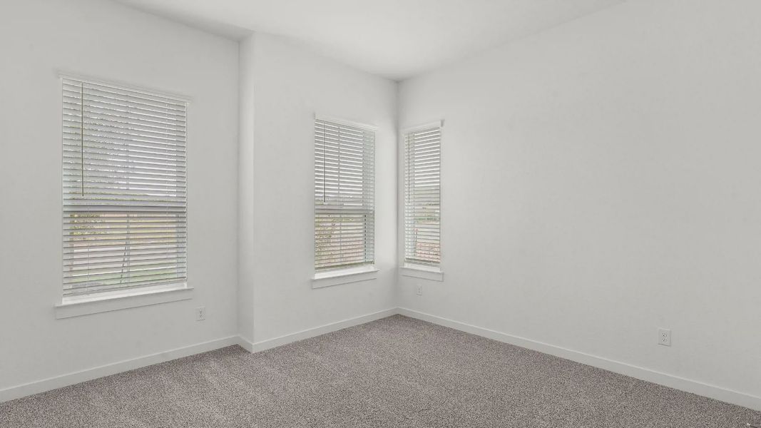 Representative unfurnished interior of a home built from the Lauren by Chesmar Homes in University Heights, Round Rock (Image 15).