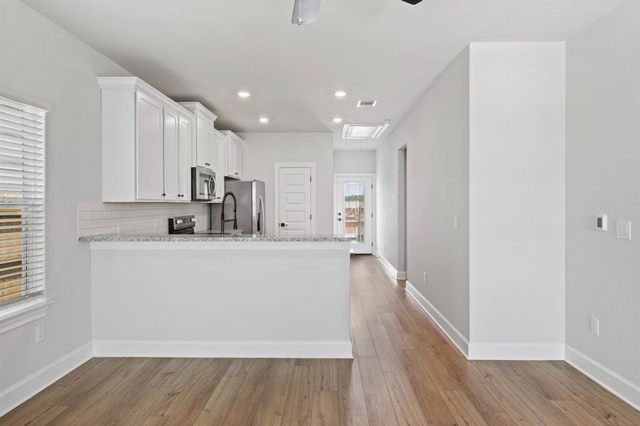 Furnished interior view inside a new home in Whisper Valley, Manor (Image 10).