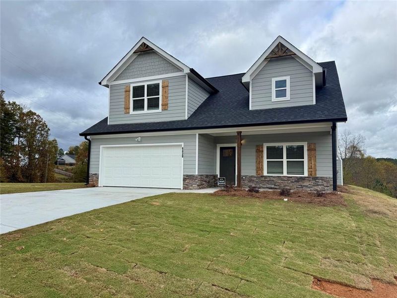 Front exterior of a new home in , Lula, GA, highlighting curb appeal (Image 1).
