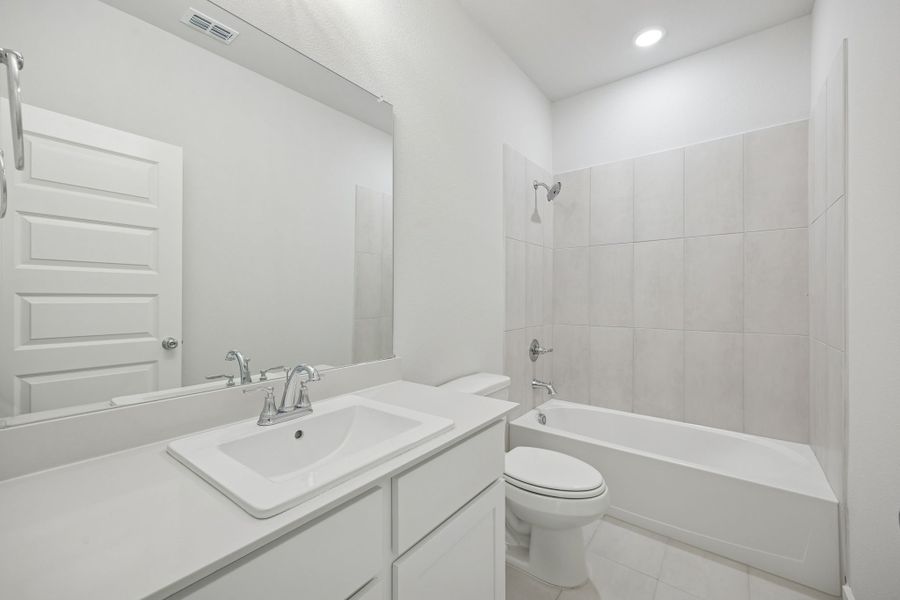 Bathroom in the Masters home plan by Trophy Signature Homes – REPRESENTATIVE PHOTO