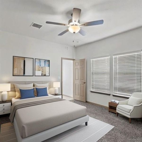 Three of three spacious secondary bedrooms featuring a lofty ceiling, large windows and elegant fan with lighting fixture. **This image is from another Saratoga Home with similar floor plan - Myrtle Floorplan.**