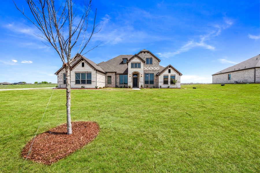 Front exterior of a new home in Berkshire Estates, Mesquite, TX, highlighting curb appeal (Image 23).
