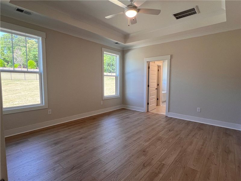 This spacious room features elegant flooring, tray