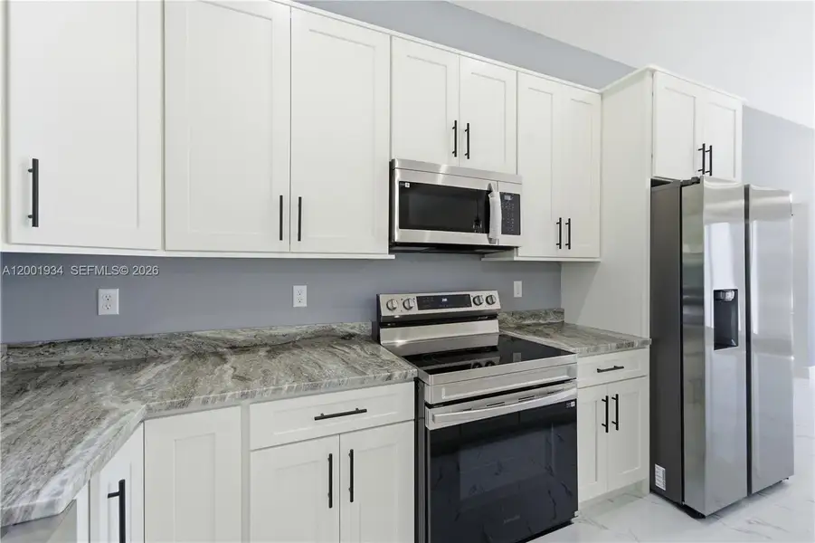 Furnished interior view inside a new home in , Port St. Lucie (Image 5).