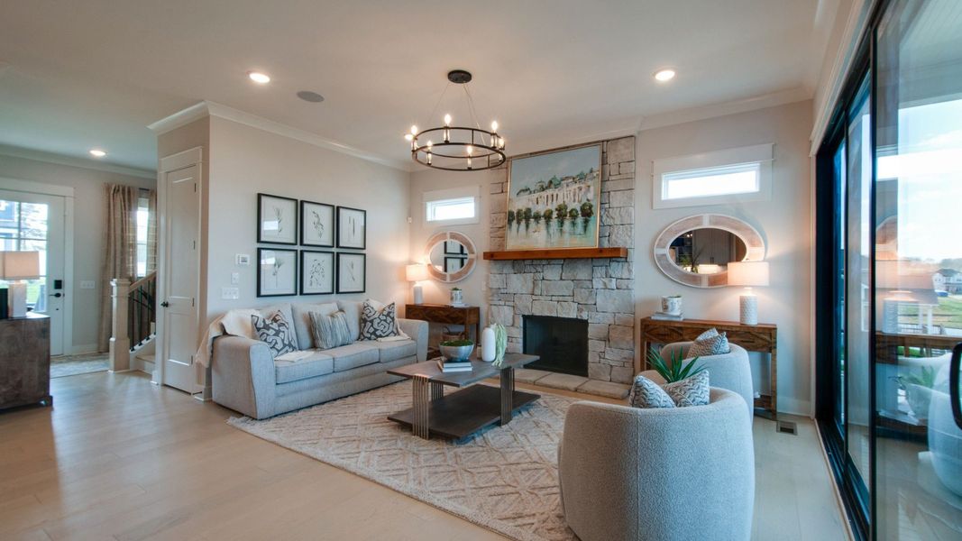 Gathering room with connecting entryway and large glass sliding doors out to the covered outdoor patio space Gathering room with connecting entryway and large glass sliding doors out to the covered outdoor patio space