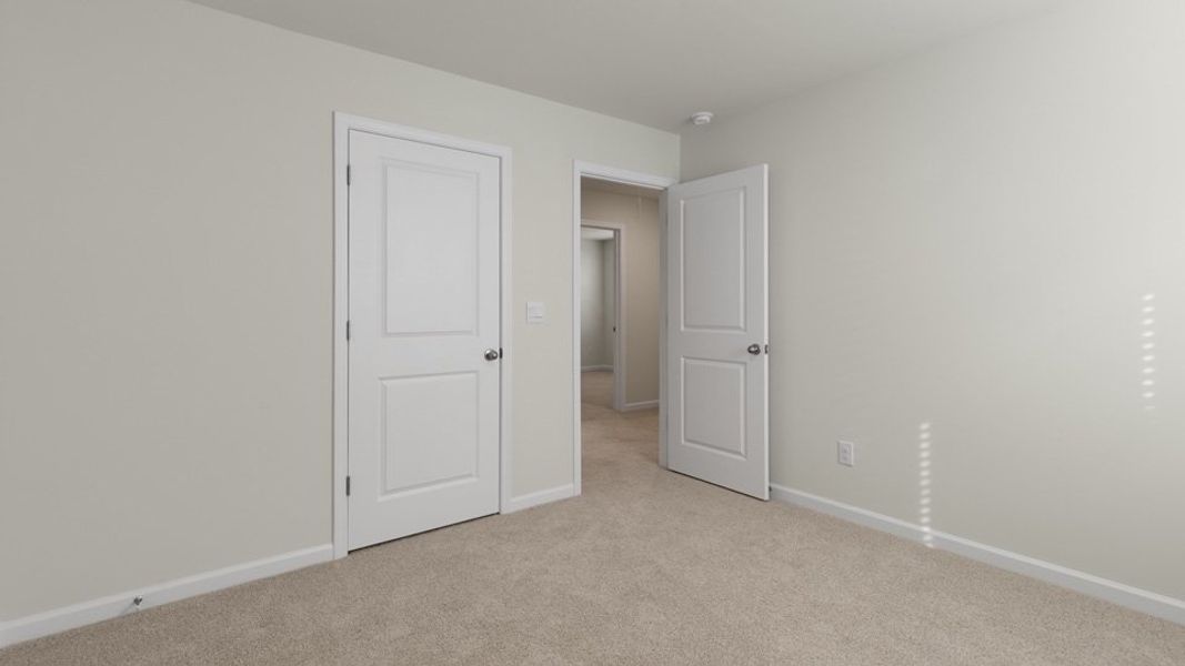 Spacious, unfurnished interior of a new home in The Grove at Matthews Landing, Fuquay Varina (Image 25).