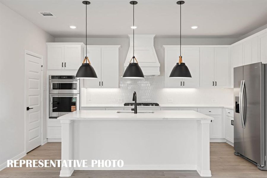 No shortage of style, storage or prep space in this wonderful kitchen!  REPRESENTATIVE PHOTO