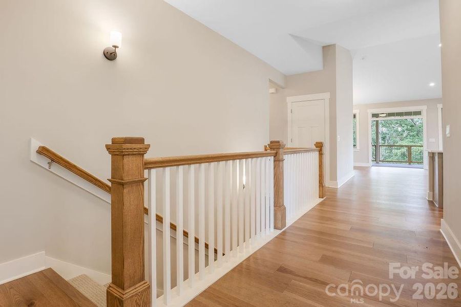 Entry hall with stairs leading to lower level.