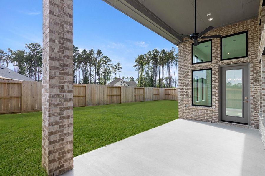 Exterior details and patio area of a home in The Highlands - 65', Porter (Image 3). Exterior details and patio area of a home in The Highlands - 65', Porter (Image 3).
