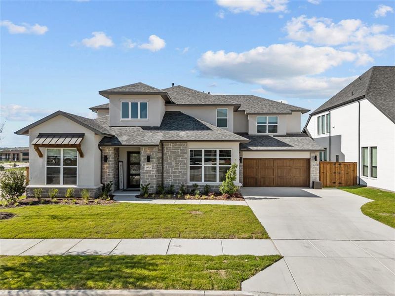 Front exterior of a new home in , Aledo, TX, highlighting curb appeal (Image 1). Front exterior of a new home in , Aledo, TX, highlighting curb appeal (Image 1).